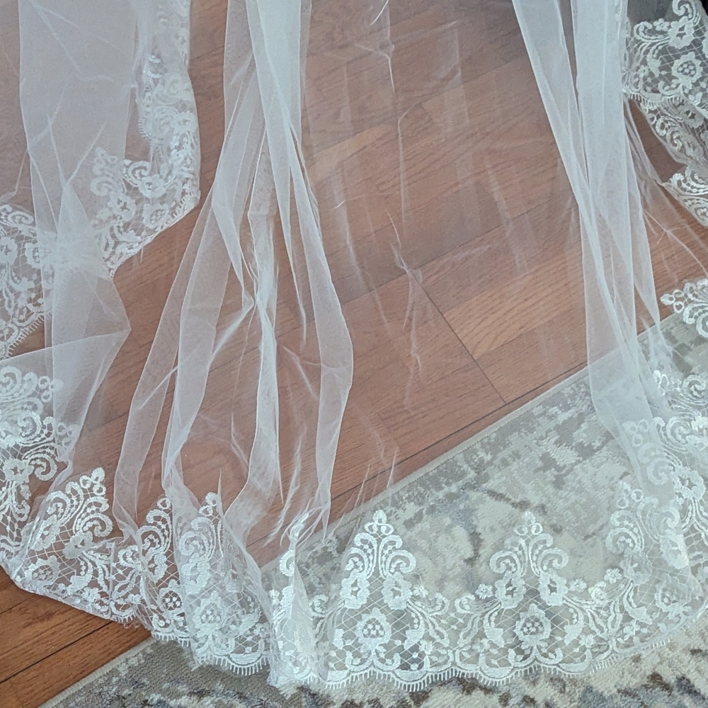 White and lace drapes/cape for wedding gown